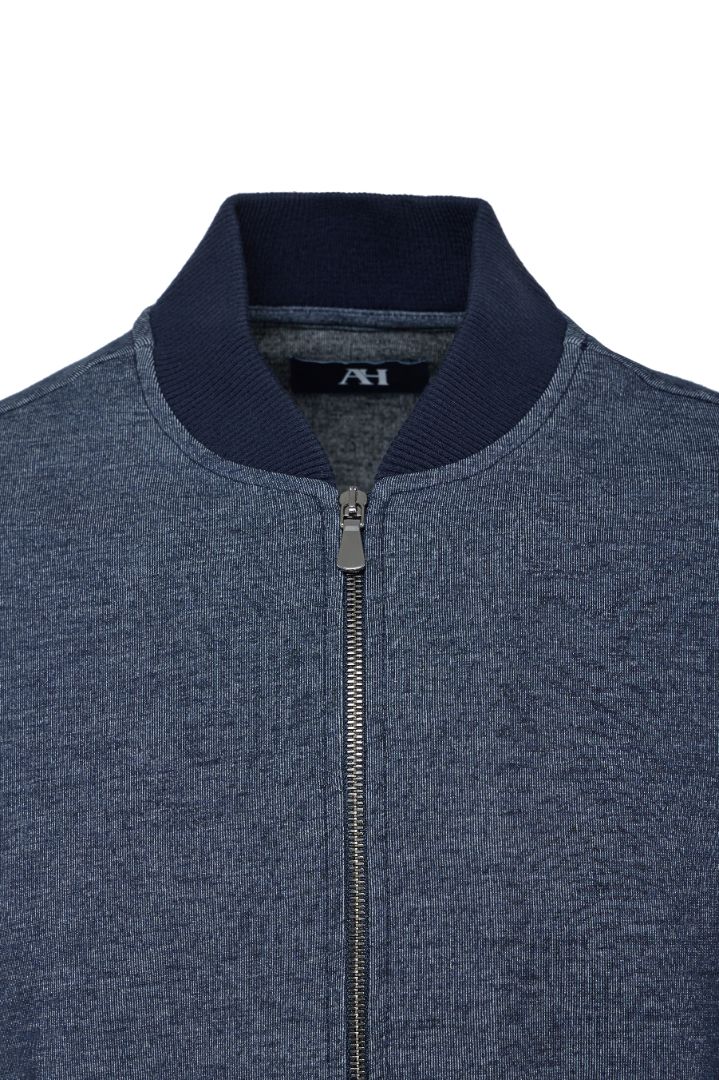 Blue zip-up sweater with navy collar on a white background