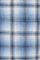 Close-up of blue and white plaid fabric pattern