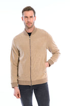 Man wearing a beige jacket on a white background