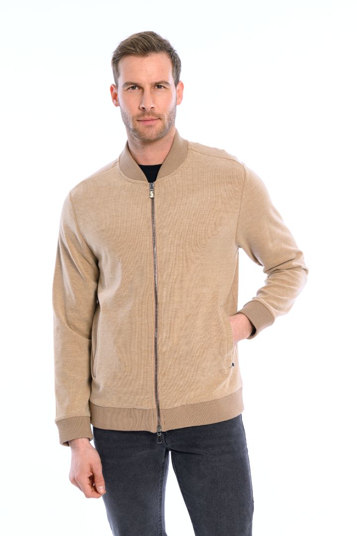 Man wearing a beige jacket on a white background